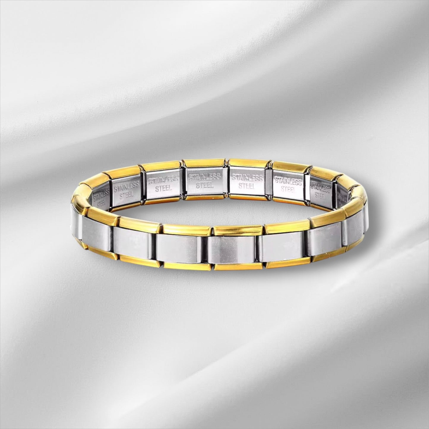 Sudraba–zelta charm aproce