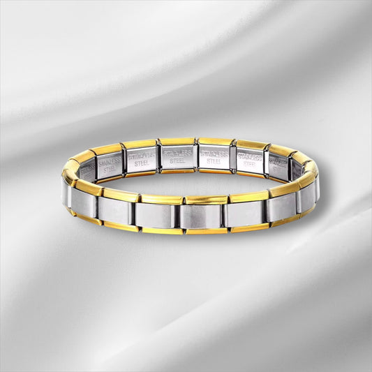 Sudraba–zelta charm aproce